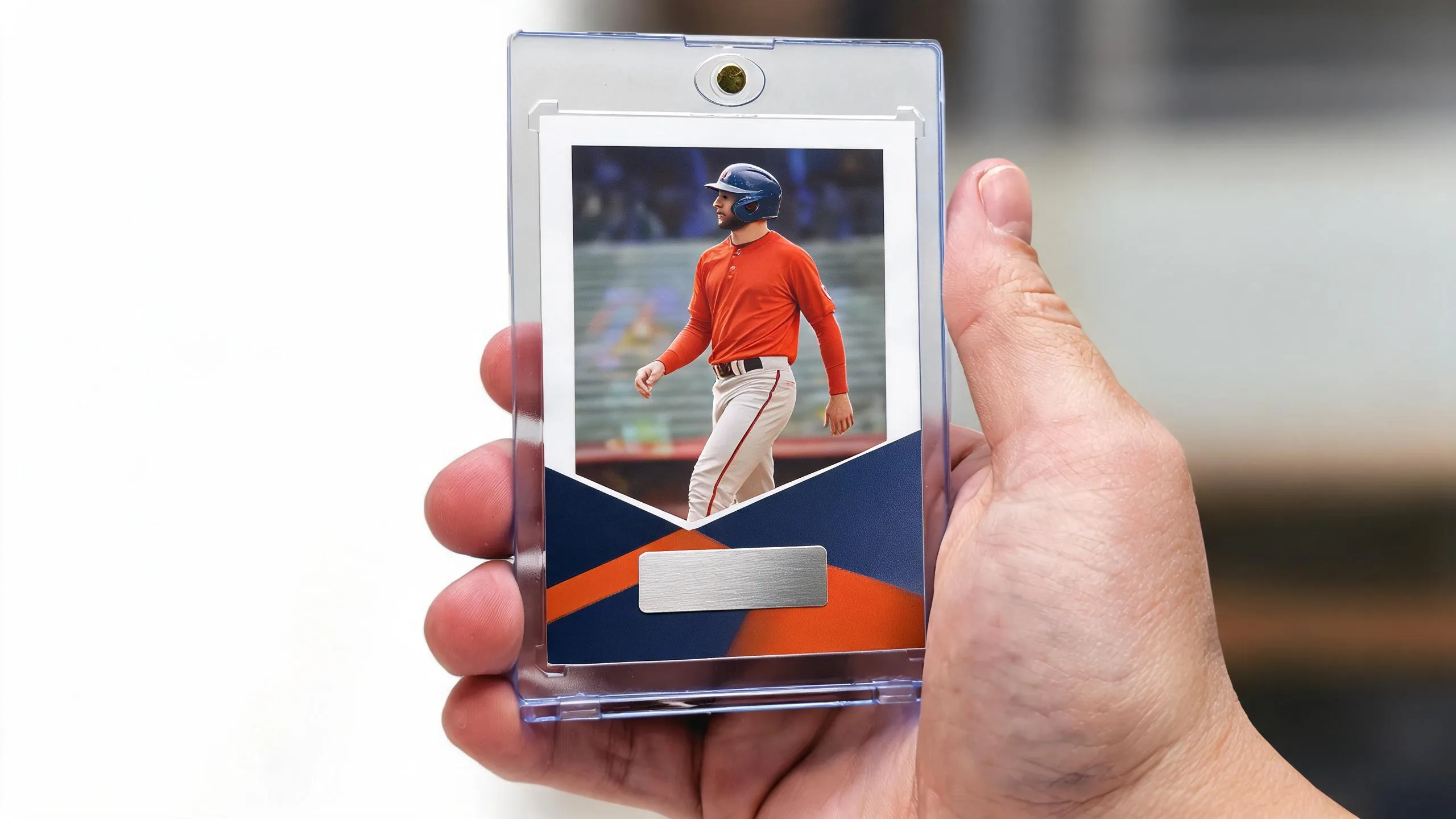 Hand holding magnetic case with athlete card, illustrating best vitamins for young athletes.