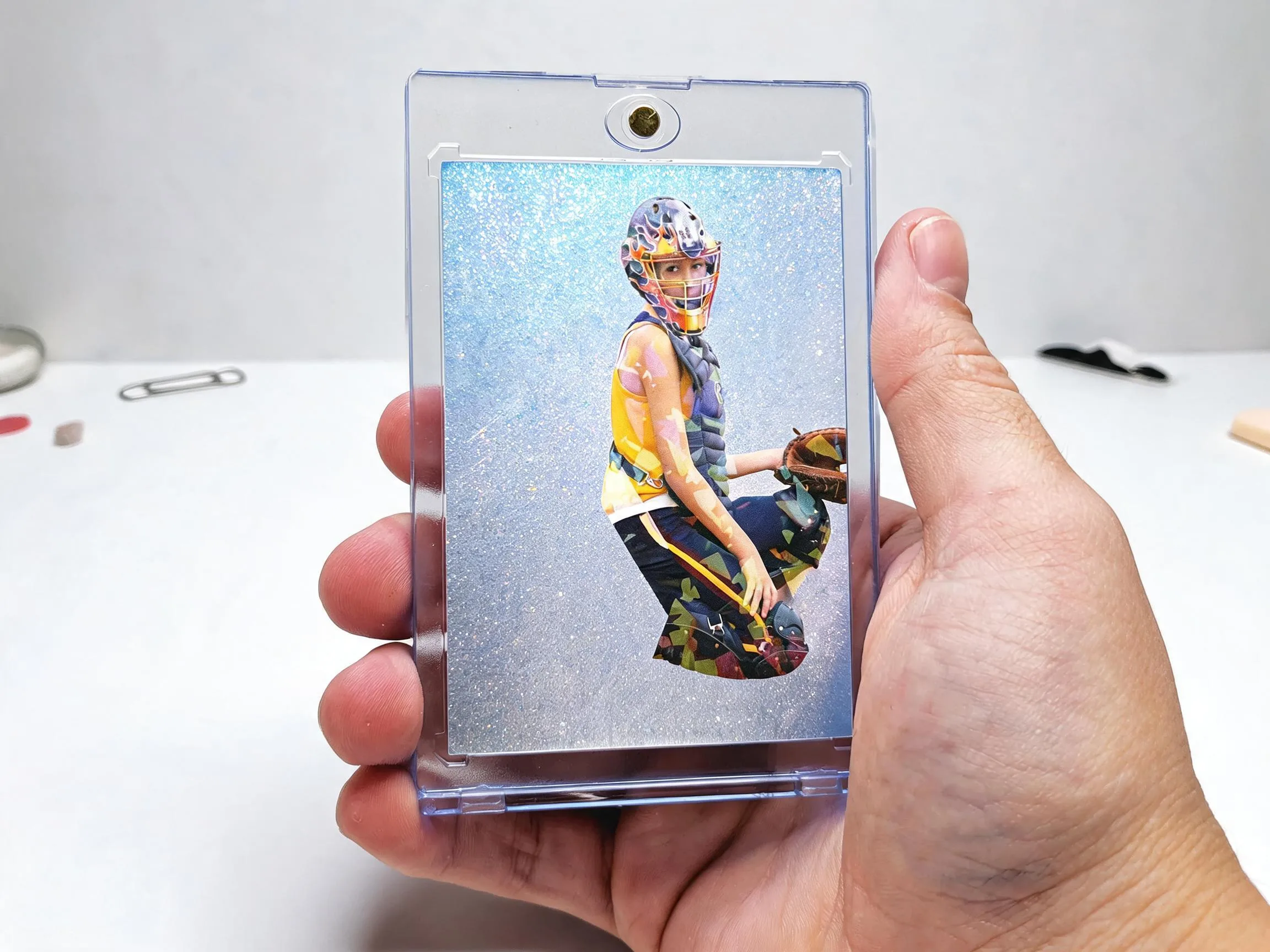 Custom keepsake trading card in a magnetic case, icy silver-blue refractor athlete design.