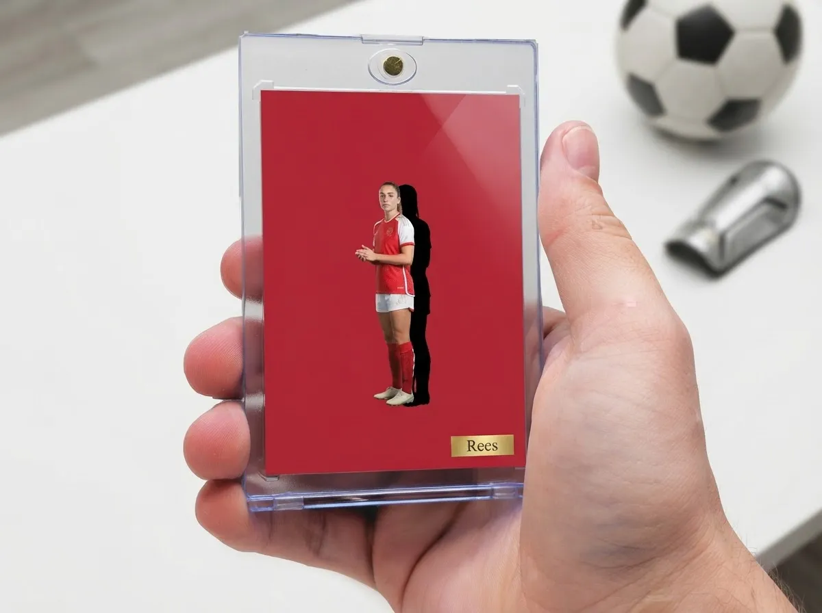Custom soccer trading card in magnetic case, bold red editorial design on tabletop.
