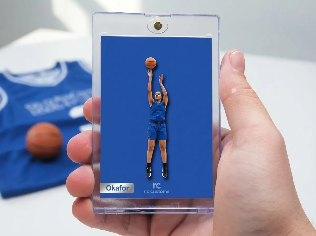Hand holding r c customs magnetic case with bold blue basketball trading card inside.