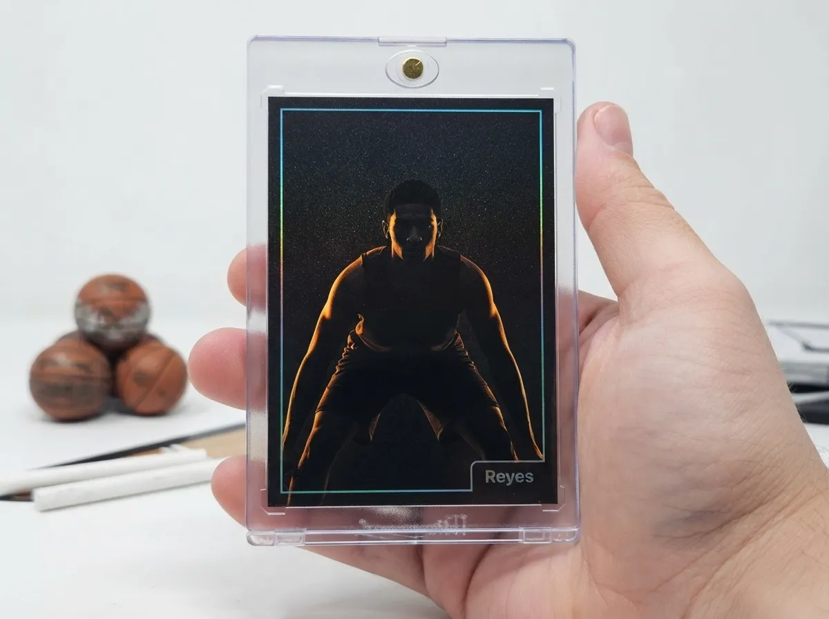 Hand holding rc custom magnetic case with dark neon-rimmed basketball trading card.