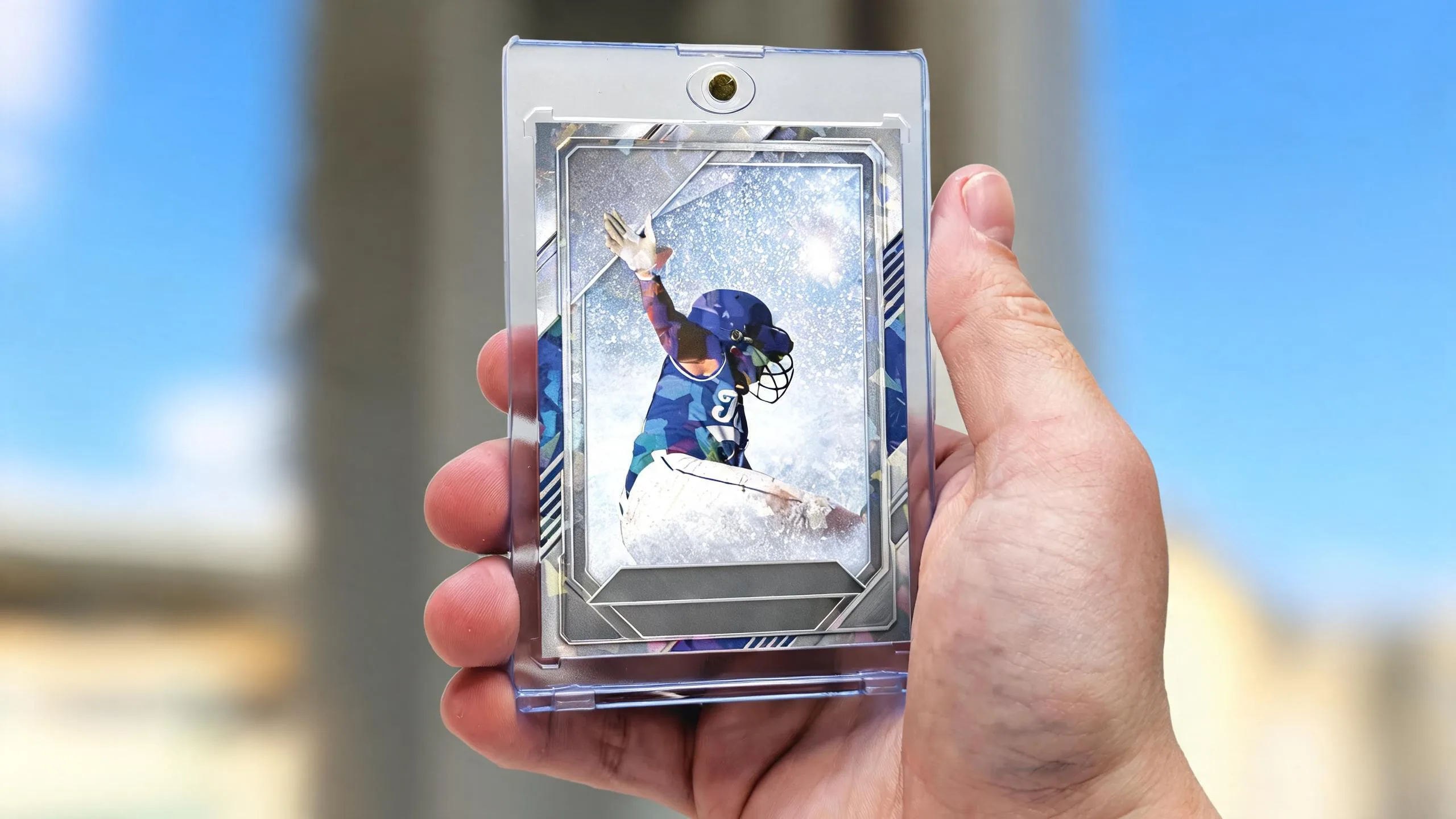 Hand holding magnetic case with athlete card, sports card shops Des Moines display