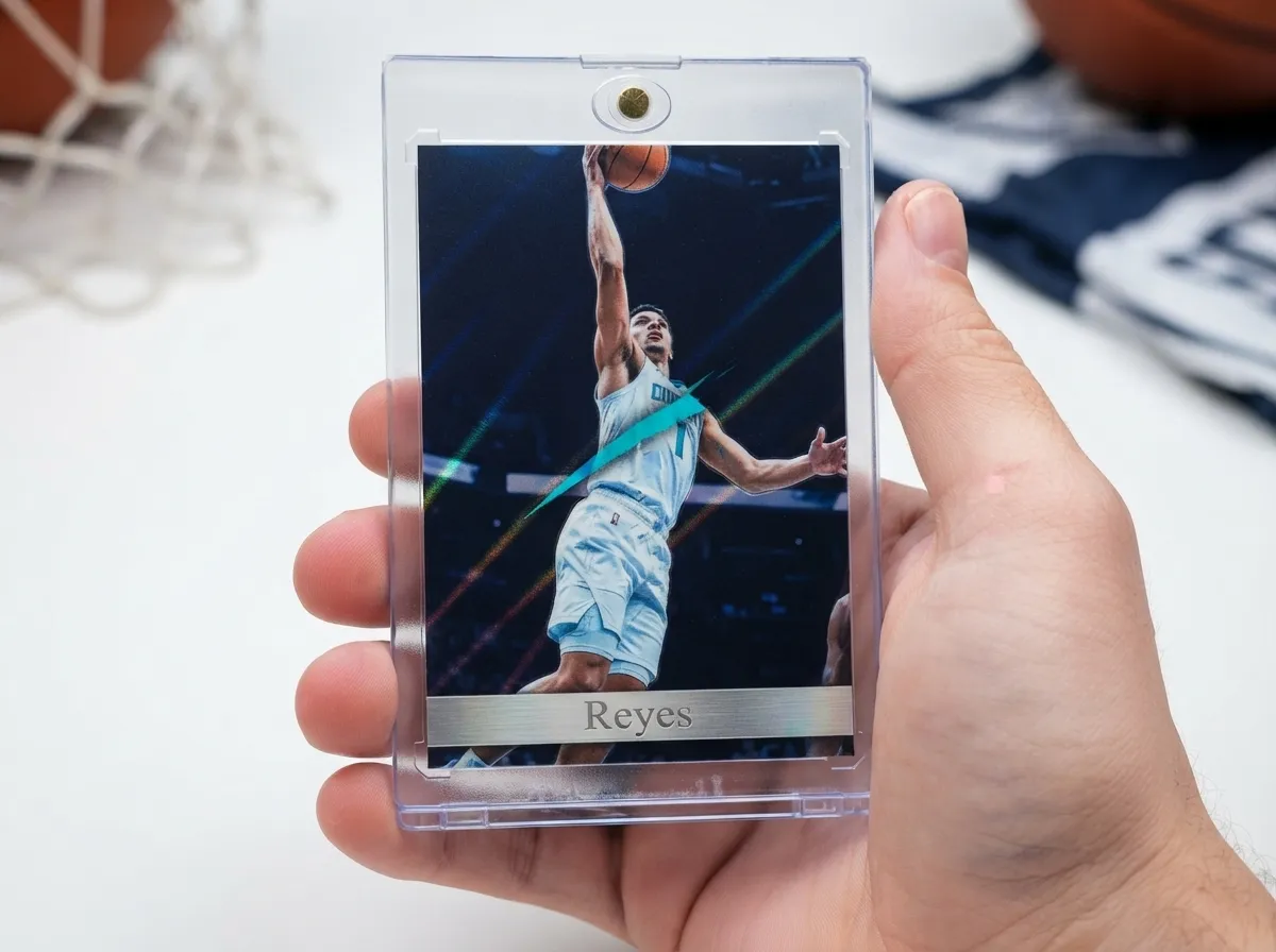 Custom sports trading card with chrome finish displayed in clear magnetic case on hand.