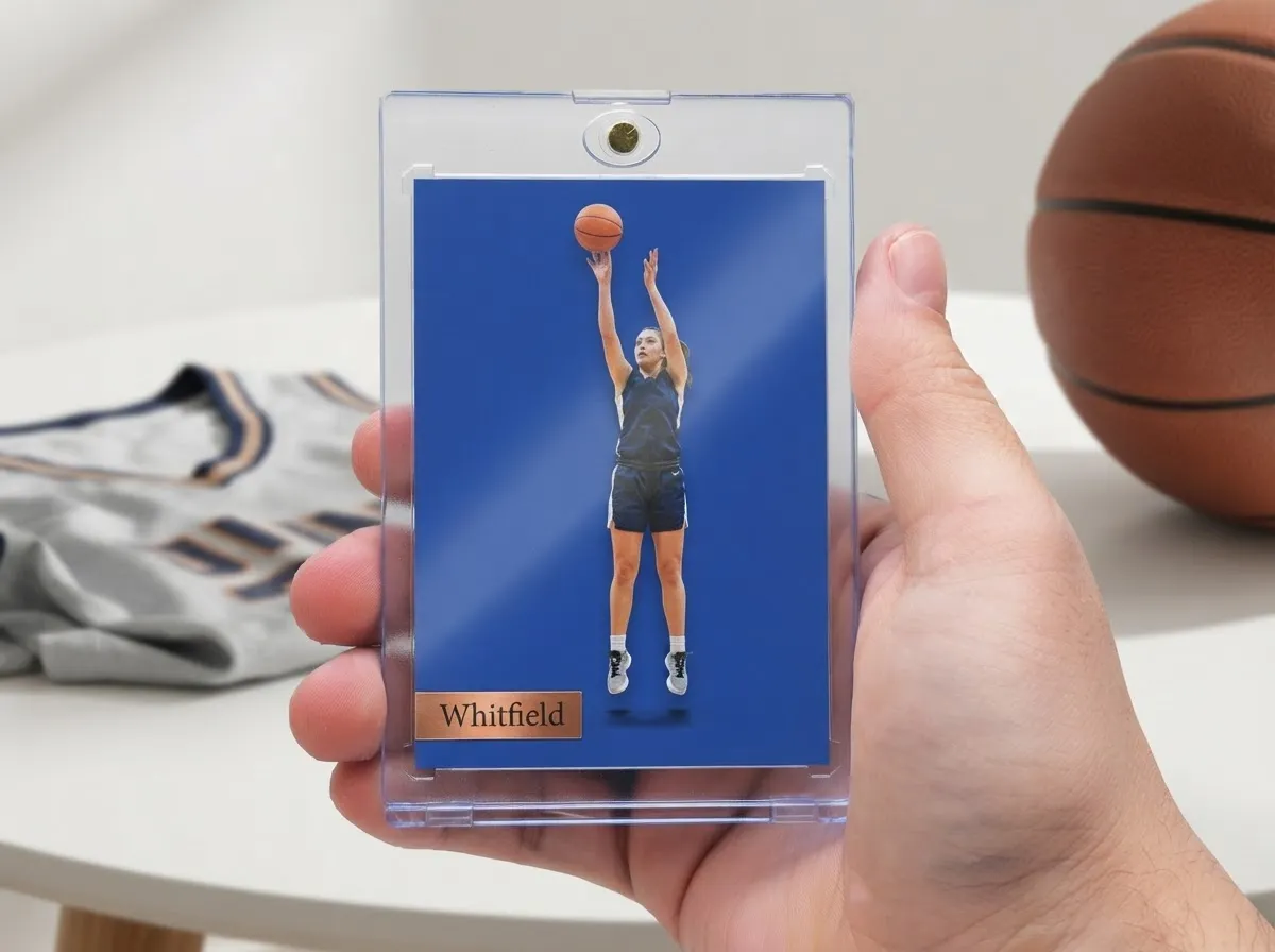 Hand holding magnetic case with cobalt editorial-style basketball sweet 16 trading card.